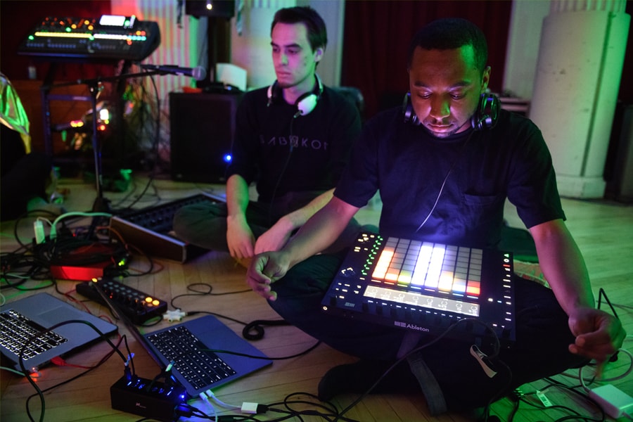 Students perform on electronic music equipment at the Snoozefest event at Carnegie Mellon
